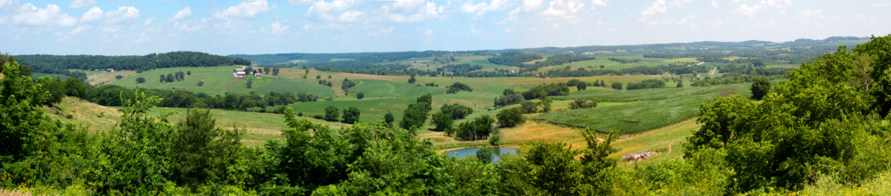[Several photos stitched together showing the wide expanse of rolling hills farmland.]